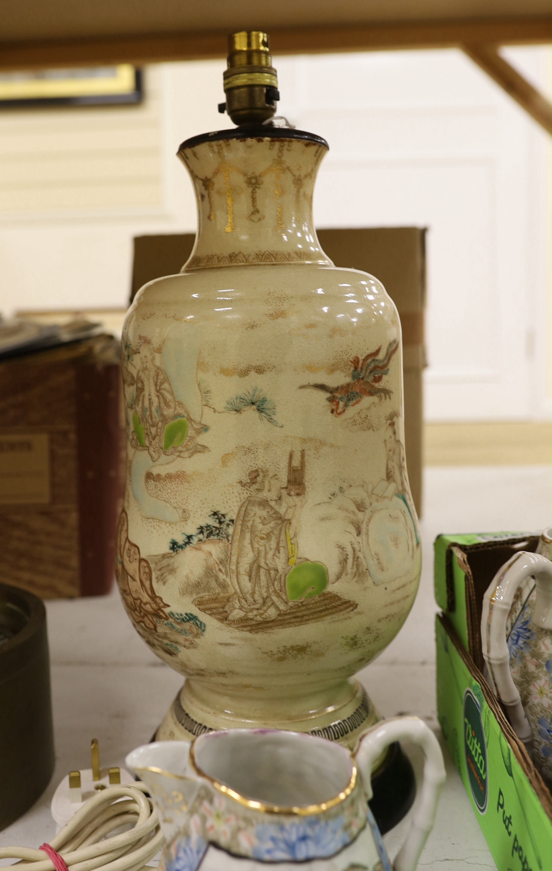 A group of Japanese ceramics, possibly Meiji including a teapot, a miniature Kutani vase and Japanese fluted bowls, etc., largest 21cm in diameter, a Japanese Satsuma lamp base and a pot and cover, possibly Meiji period,